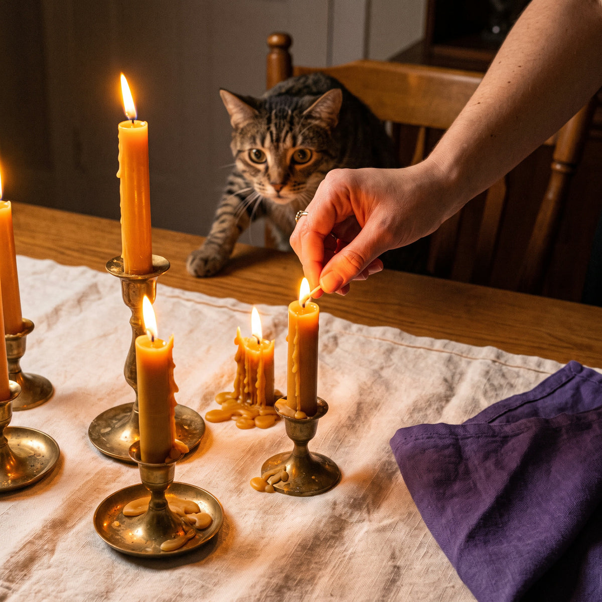 Real wax candles dripping on the table